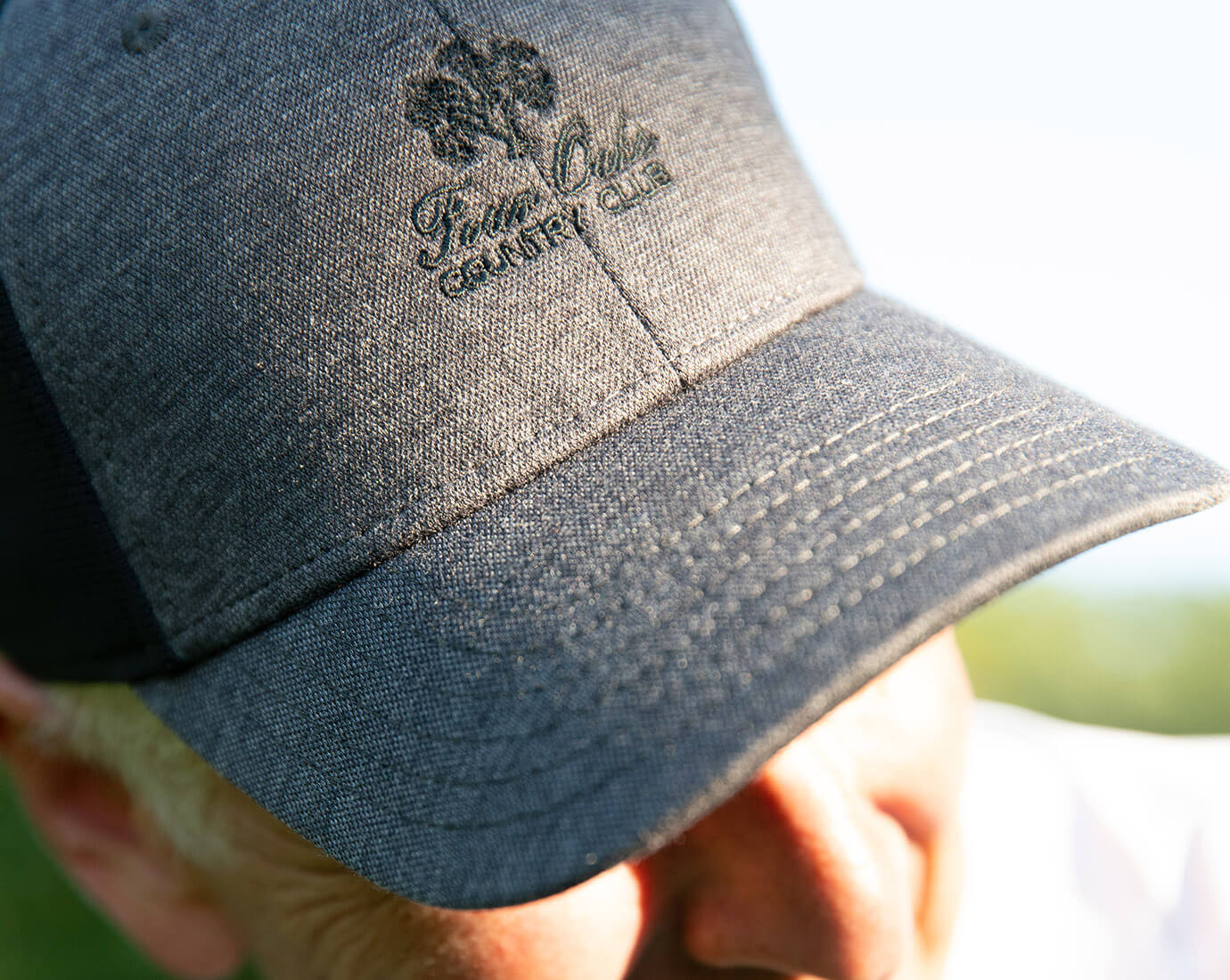 gray cap with Four Oaks logo